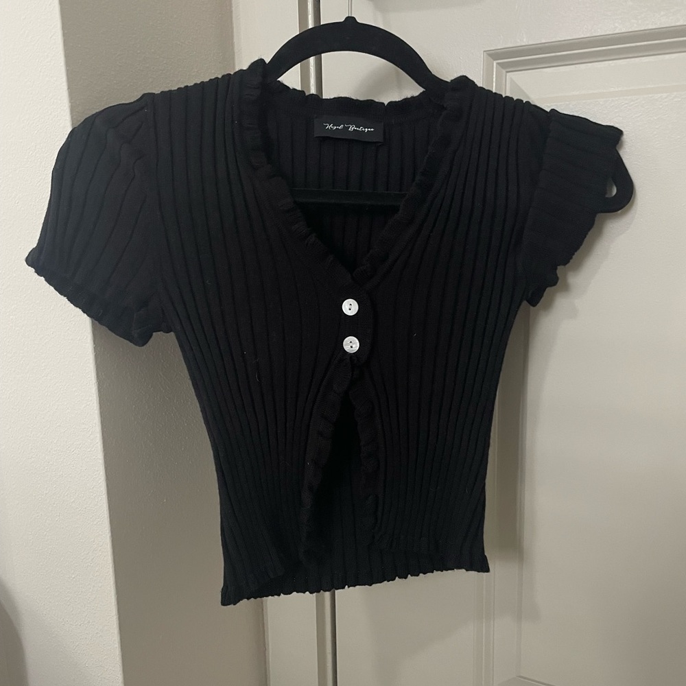 Black knit cropped top with two button closure